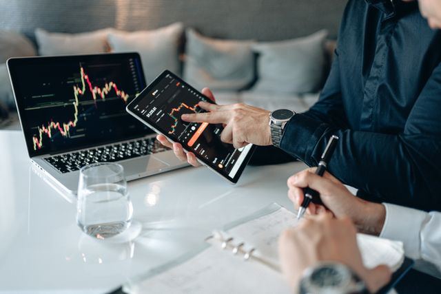 Finwise analysts reviewing financial charts